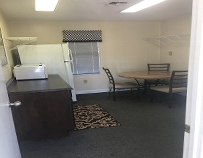Room with Fridge and Microwave